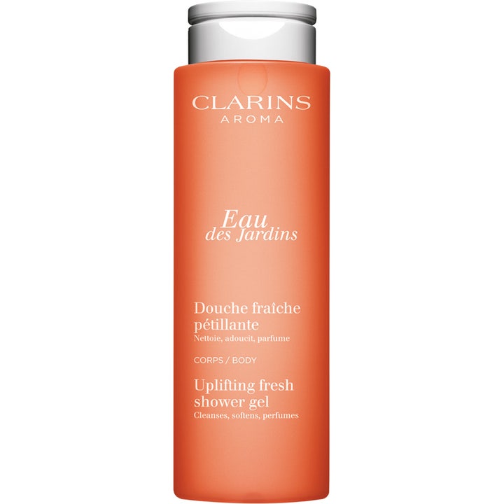 Clarins Eau des Jardins 200 ml forfriskende showergel i en mat orange flaske med sølvlåg til kropspleje