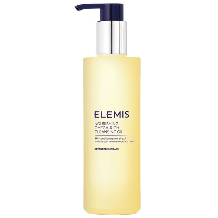 Elemis Nourishing Omega-Rich Cleansing Oil nærende ansigtsrens i frostet flaske med mørkeblå og sølv pumpe