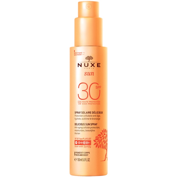 Nuxe Sun Delicious Sun Spray SPF 30 150 ml solspray der giver fugt og beskyttelse i en ferskenfarvet flaske med pumpe.