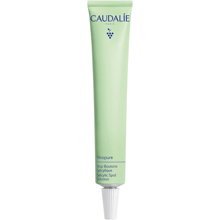 Caudalie Vinopure Salicylic Spot Solution 15ml mod urenheder i en lysegrøn tube med hvid spids applikator.
