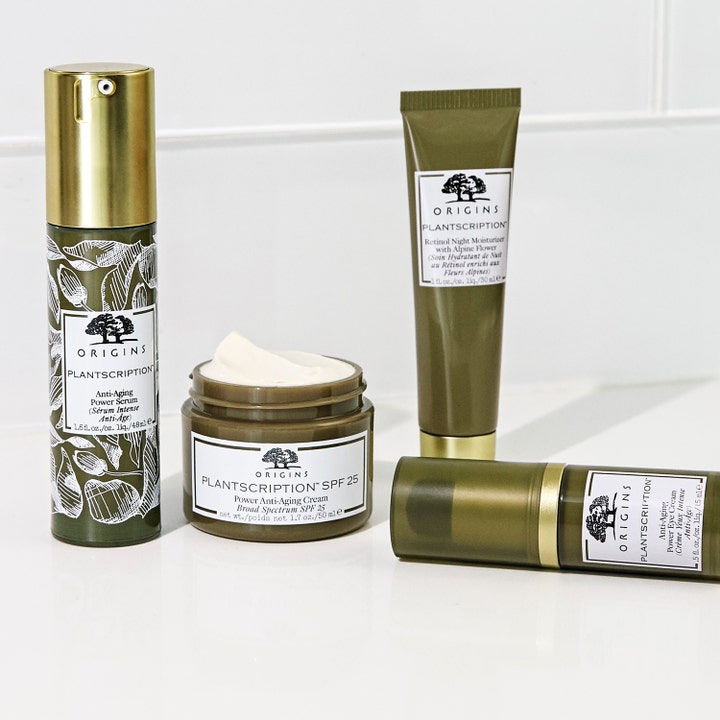 Origins Plantscription Retinol Night Moisturizer 30 ml nattcreme i grøn tube ved siden af en krukke med hvid creme