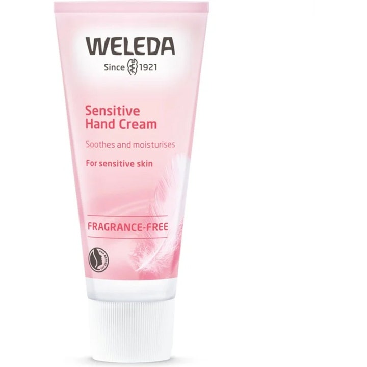 Weleda Sensitive Hand Cream beroligende parfumefri håndcreme i lyserød tube med hvidt låg og fjer.