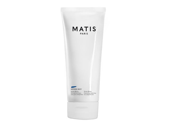 Matis Réponse Body Hydra-Motion fugtgivende kropscreme i hvid tube med sort tekst og et blåt strejf.