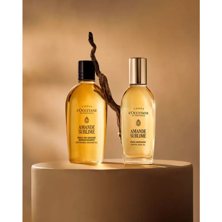 L'Occitane en Provence Almond Shower Oil 250 ml blødgørende kropspleje i elegante flasker ved en gren