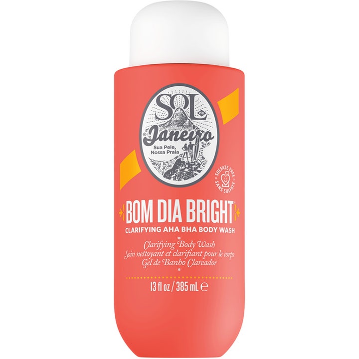 Sol de Janeiro Bom Dia Bright 385 ml eksfolierende AHA BHA body wash i koralrød flaske med hvidt låg.