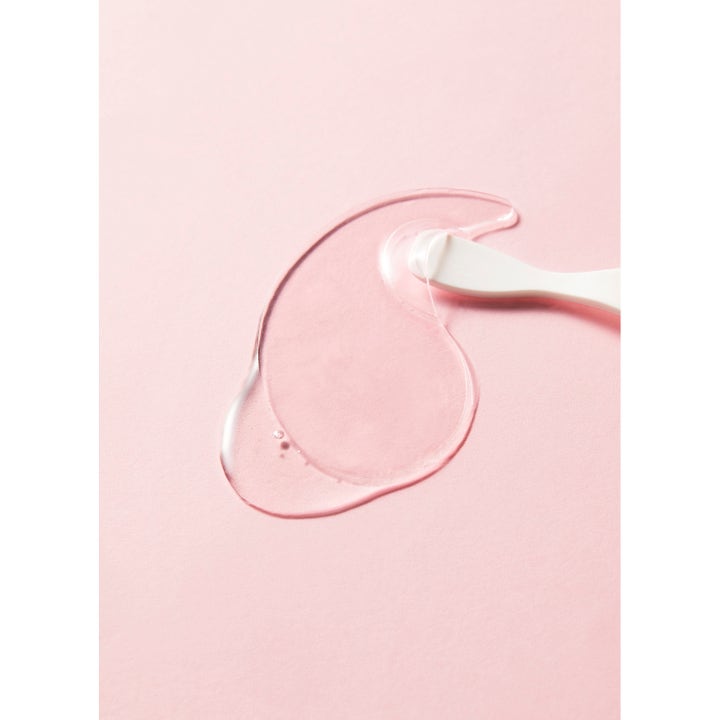 COSRX The Peptide Collagen Hydrogel Eye patch 60 stk fugtgivende øjenmaske gennemsigtig gelpatch på lyserød baggrund.