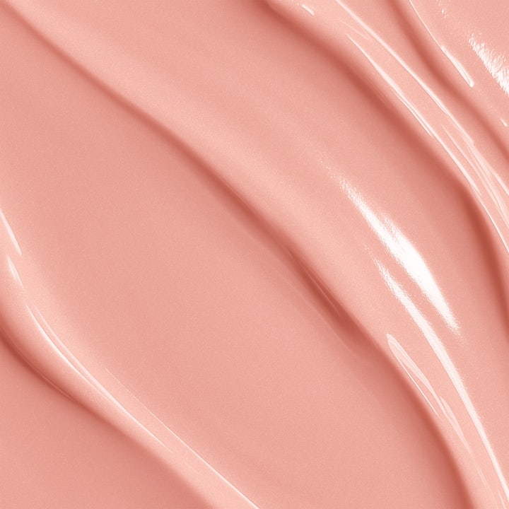 Biotherm Collagen Fit Body Cream 200 ml opstrammende kropscreme i hvid krukke med rosaguldstribe holdt af en hånd