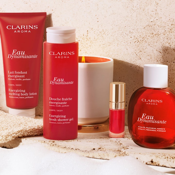 Clarins Eau Dynamisante 200 ml shower gel energigivende kropspleje i rød flaske med hvidt låg