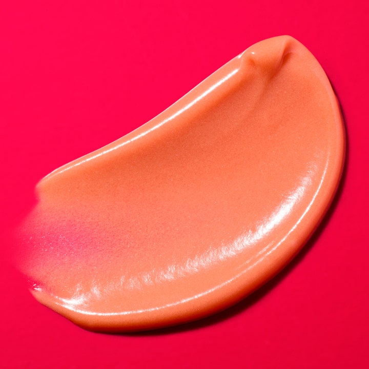Nuxe Merveillance Lift Glow 50 ml opstrammende dagcreme viser en cremet ferskenfarvet tekstur med masser af glød.