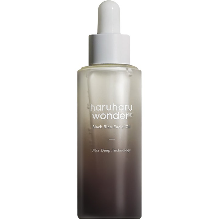 Haruharu Wonder Black Rice Facial Oil 30ml nærende ansigtsolie i en frostet glasflaske med mørk gradient og hvid pipette