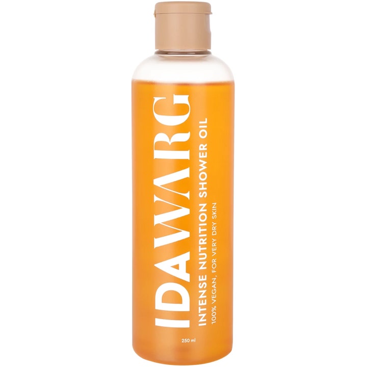 IDA WARG Intense Nutrition Shower Oil 250 ml nærende kropspleje i klar flaske med orange olie og beige låg