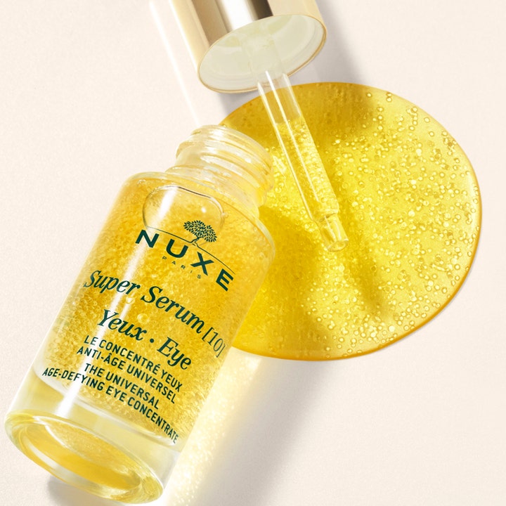 Nuxe Super Serum [10] Eye 15 ml anti-age øjenserum med gylden tekstur af mikrokugler og pipette i glasflaske