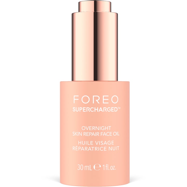 FOREO SUPERCHARGED Overnight Skin Repair Face Oil 30 ml reparerende ansigtsolie i ferskenfarvet flaske med rosaguld låg