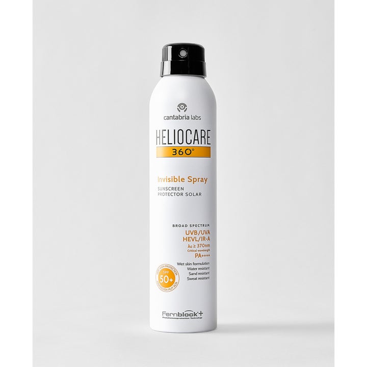 Heliocare Invisible Spray SPF 50+ 200 ml solcreme i hvid sprayflaske med sort låg beskytter huden mod UV-stråler