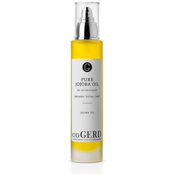 C/O Gerd Pure Jojoba Oil 100 ml økologisk ansigtsolie der giver fugt i klar flaske med gul olie og sølvpumpe