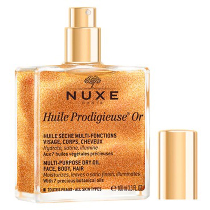 Nuxe Huile Prodigieuse Or 100 ml glødgivende tørolie i firkantet glasflakon med gyldne glimmerpartikler og guldlåg