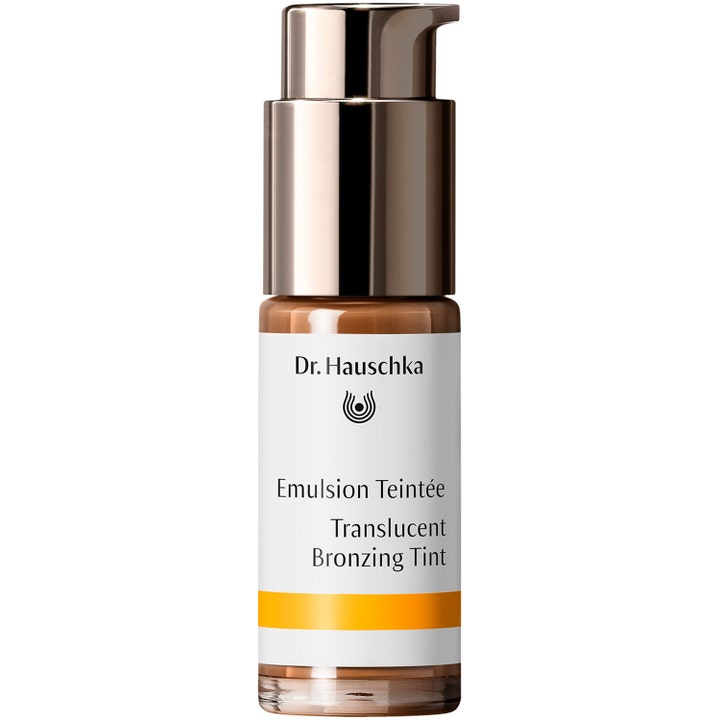 Dr. Hauschka Translucent Bronzing Tint 18 ml giver naturlig glød i en glasflaske med metallic bronzefarvet pumpe.