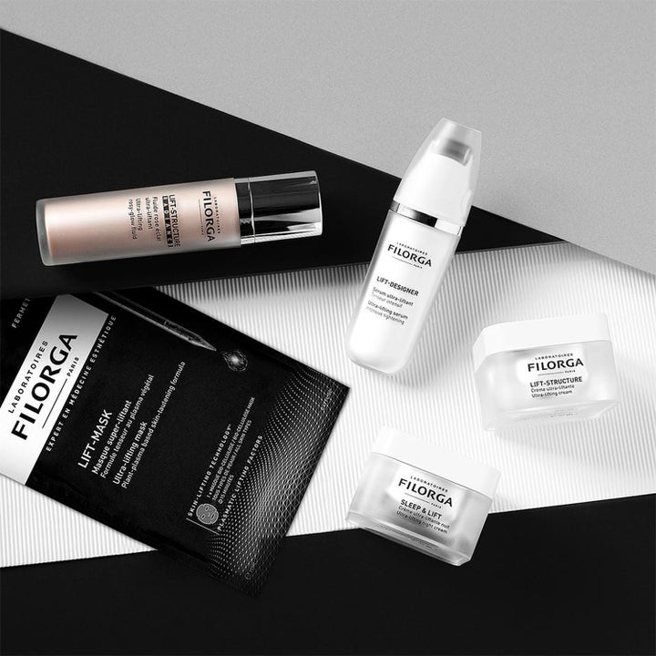 Filorga Lifting & Firming Set hudplejesæt med opstrammende cremer og ansigtsmaske på grafisk baggrund.