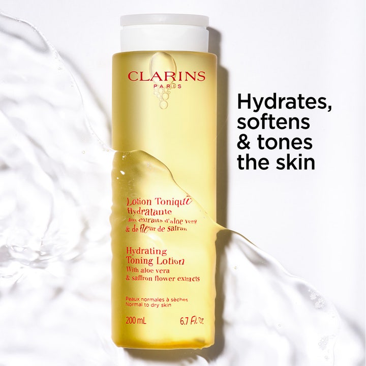 Clarins Hydrating Toning Lotion 400 ml fugtgivende skintonic i gul flaske med vandstænk