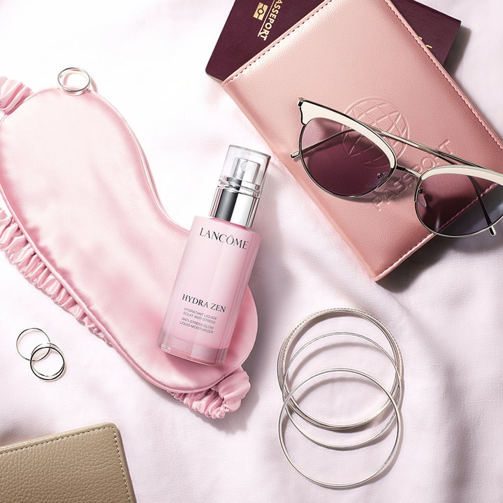 Lancôme Hydra Zen Liquid Moisturizer 50 ml fugtgivende dagcreme i lyserød pumpeflaske med sovemaske og solbriller