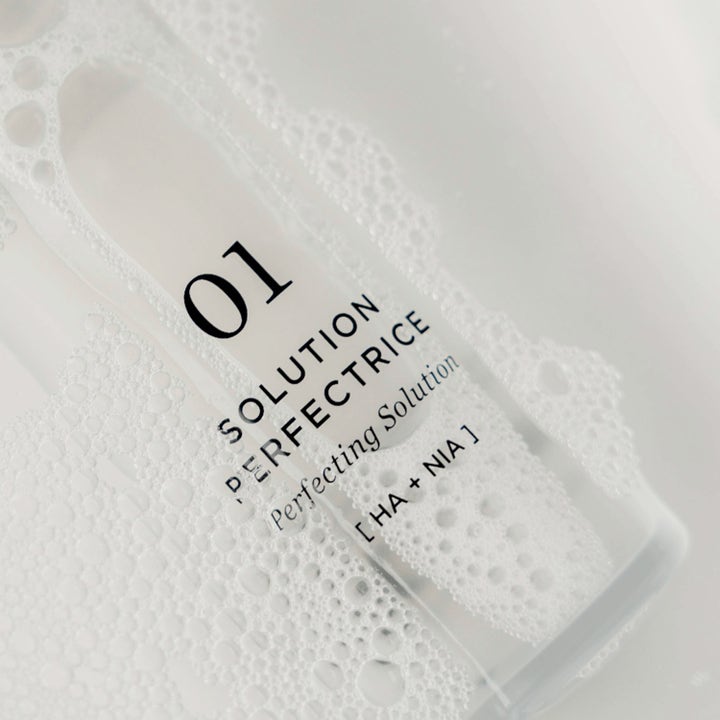 Codage Paris The Perfecting Solution N°01 150 ml eksfolierende toner i klar flaske dækket af hvidt skum med HA + NIA