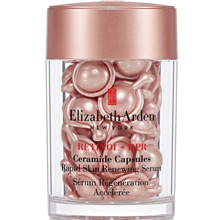 Elizabeth Arden Retinol + HPR Ceramide Capsules hudfornyende serum i klar krukke med rosa guld låg og kapsler.