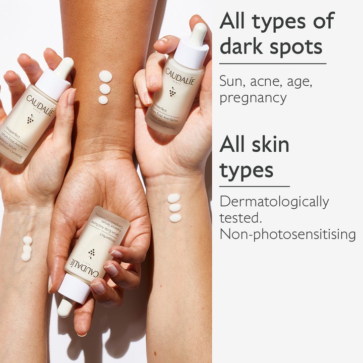 Caudalie Vinoperfect Radiance Serum 30 ml mod mørke pletter vist på forskellige hudtoner med hvide dråber