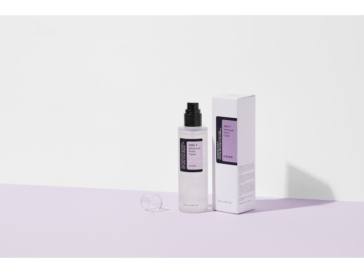 COSRX AHA 7 Whitehead Power Liquid 100 ml eksfolierende toner i frostet flaske med sort pumpe og hvid æske.