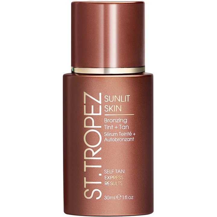 St. Tropez Sunlit Skin 30 ml selvbruner serum der giver glød i en metallisk brun flaske med pumpe