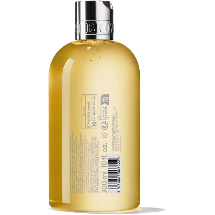 Molton Brown Flora Luminare Bath & Shower Gel 300 ml badesæbe i klar flaske med gul væske og synlig ingrediensliste