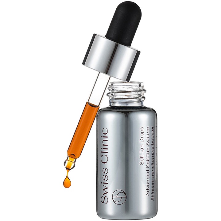 Swiss Clinic Self-Tan Drops 15ml selvbruner giver glød med en ravgylden dråbe fra en sølvfarvet pipette.