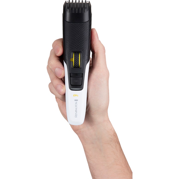 Remington MB4000 Style Series Beard Trimmer B4 skægtrimmer i hånden med hvidt og sort design og gult zoomhjul.