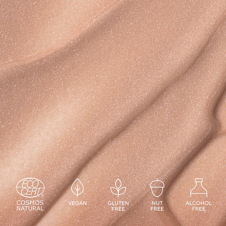 MÁDARA H2O Tint Hyaluron Tinted Serum 30 ml fugtgivende serum med glitrende beige tekstur og veganske ikoner