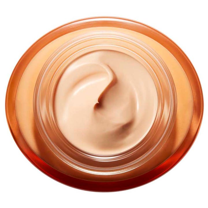 Clarins Extra-Firming Energy 50 ml dagcreme med ferskenfarvet tekstur i en åben orange krukke