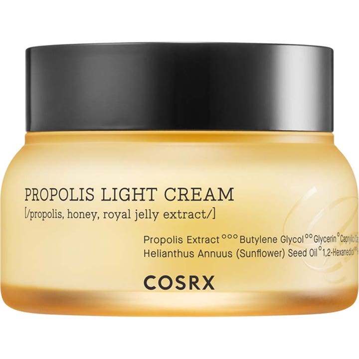 COSRX Propolis Light Cream fugtgivende ansigtscreme der giver glød i en gul krukke med sort låg