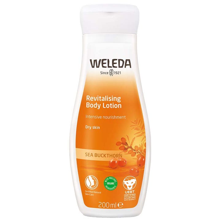 Weleda Revitalising Body Lotion 200 ml til tør hud giver intensiv pleje i hvid plastflaske med orange havtorn motiv