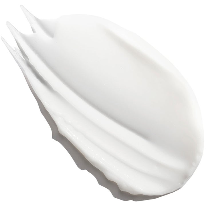 Exuviance Age Reverse + Rebuild-5 Cream 50 ml genopbyggende dagcreme med en fyldig og cremet hvid tekstur