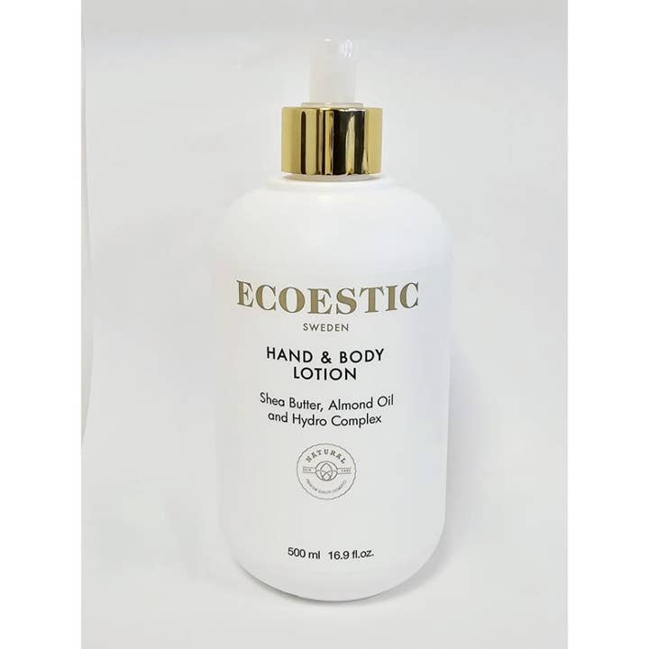 Ecoestic Hand & Body Lotion 500 ml fugtgivende kropspleje med sheasmør i hvid flaske med elegant guldpumpe.