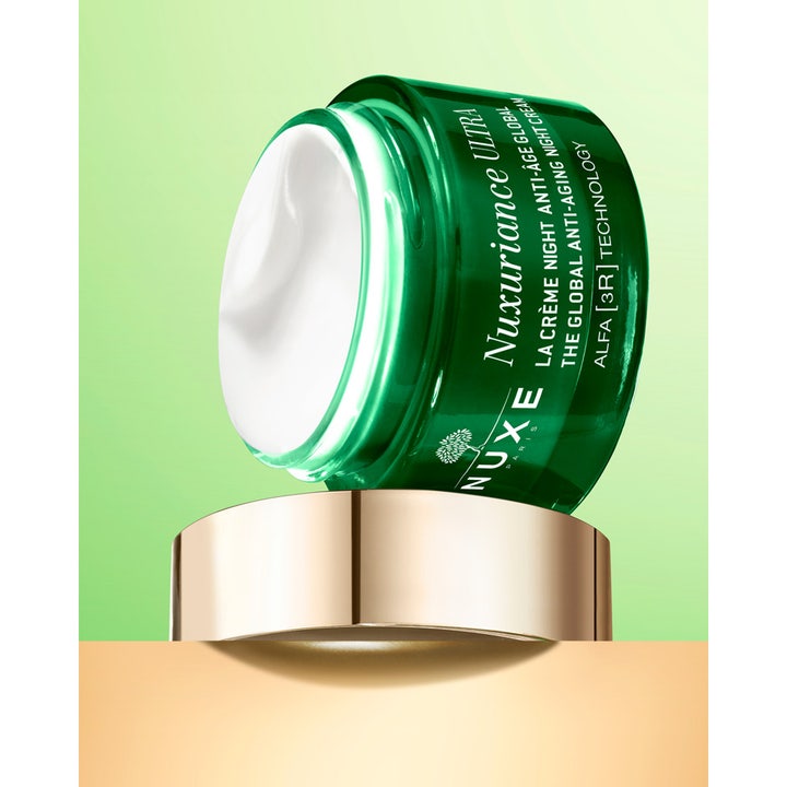 Nuxe Nuxuriance Gold 184 g anti-age natcreme med fyldig hvid tekstur i grøn glaskrukke og guldlåg.