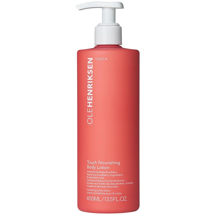 Ole Henriksen Touch Nourishing Body Lotion 400 ml fugtgivende kropspleje i koralrød flaske med hvid pumpe.