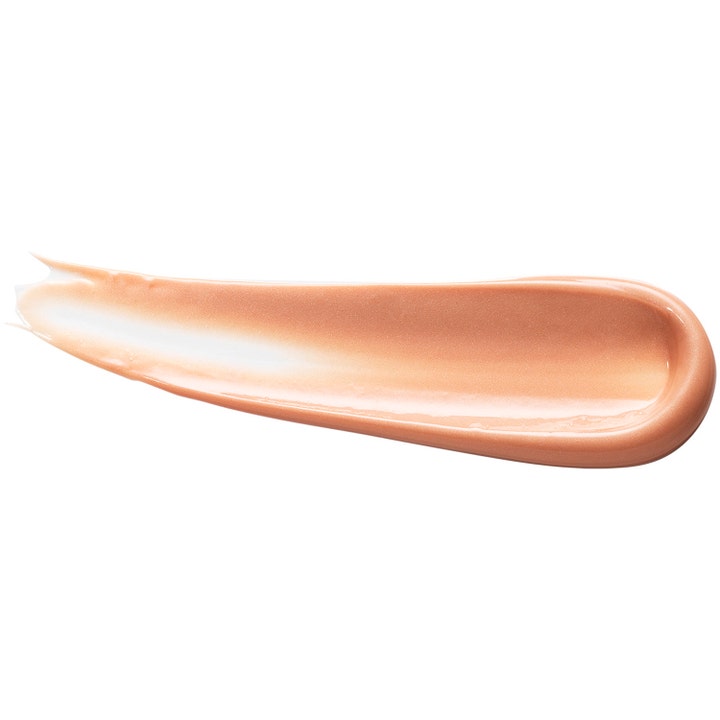 Origins GinZing Brightening Eye Cream 15 ml øjencreme lysner med en cremet varm ferskenfarvet tekstur.
