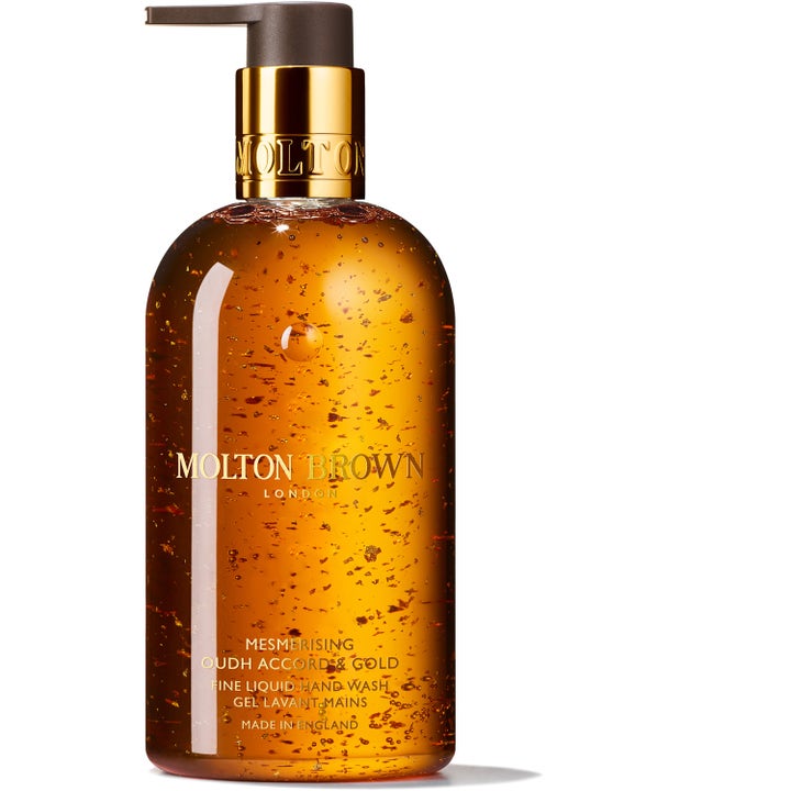 Molton Brown Mesmerising Oudh Accord & Gold 300 ml luksuriøs håndsæbe med guldflager i ravfarvet gel og gylden pumpe.