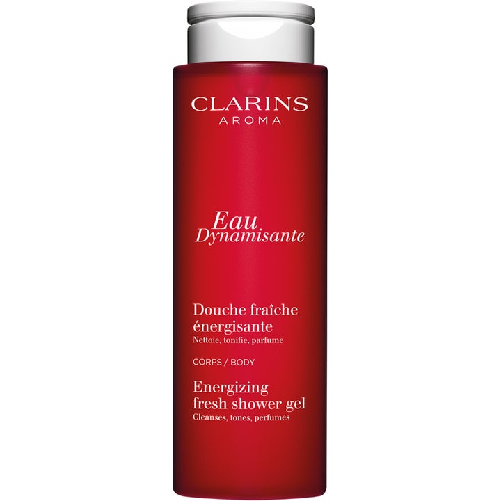 Clarins Eau Dynamisante Energizing Fresh Shower Gel energigivende badegele i en rød flaske med hvidt låg