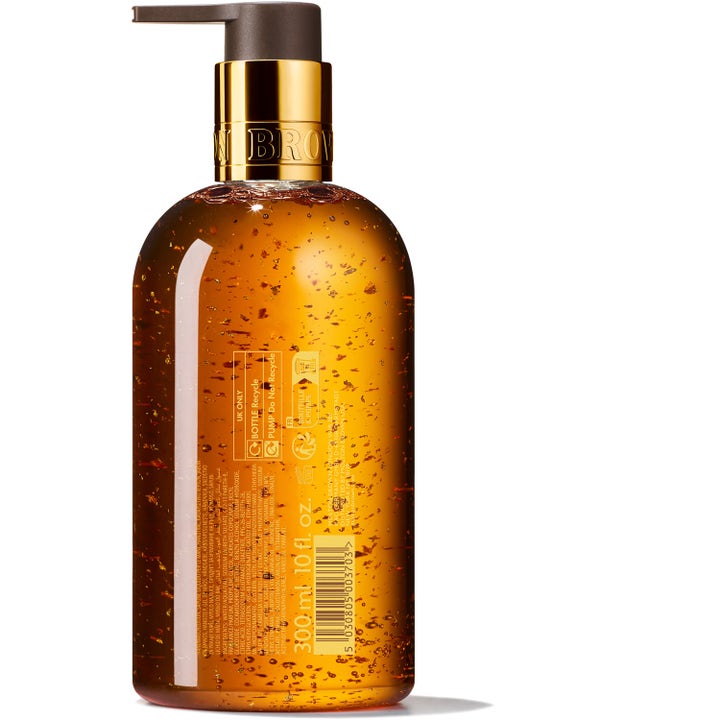 Molton Brown Mesmerising Oudh Accord & Gold 300 ml håndsæbe med glitrende guldflager i ravfarvet gel med guldpumpe