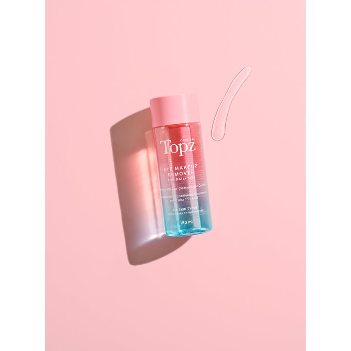 Topz Daily Eye Makeup Remover 150 ml øjenmakeupfjerner med niacinamide og hyaluronsyre i klar flaske med lyserødt låg
