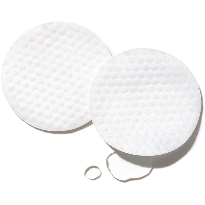 Exuviance Performance Peel AP 25 26 stk eksfolierende peeling med to hvide teksturerede rondeller og dråber.