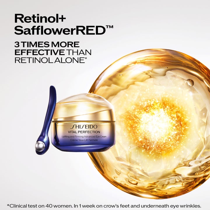 Shiseido Vital Perfection Eye Cream 15 ml med retinol og guld krukke foran en gylden glødende sfære