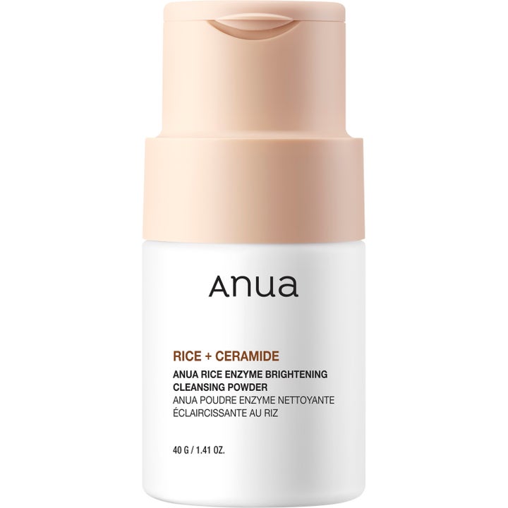 Anua Rice Enzyme Brightening Cleansing Powder 40 g eksfolierende ansigtsrens i hvid flaske med ferskenfarvet låg