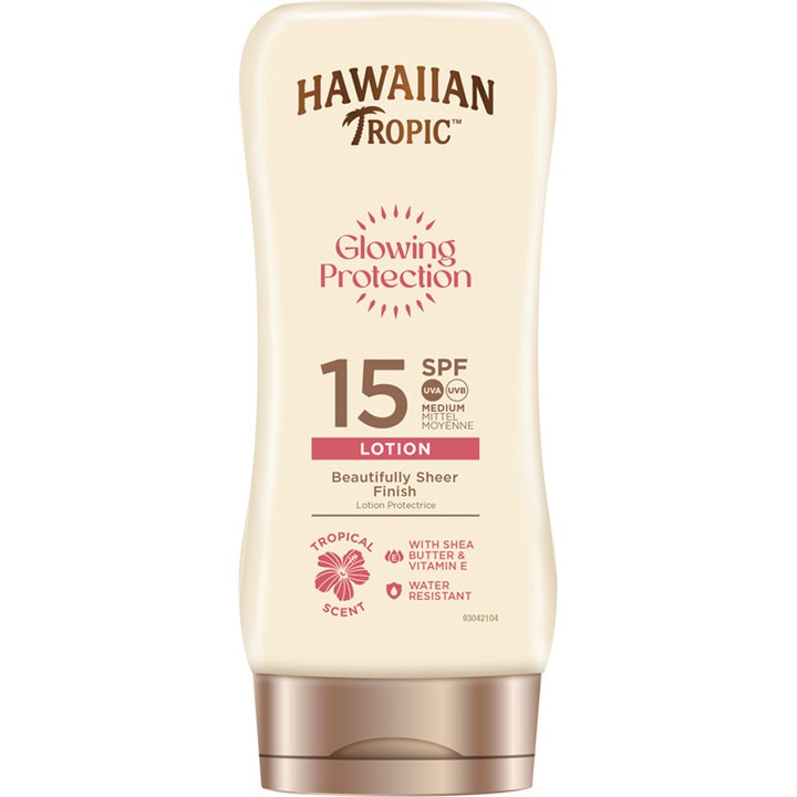 Hawaiian Tropic Glowing Protection SPF 15 solcreme giver en strålende finish i en beige tube med bronzefarvet låg.