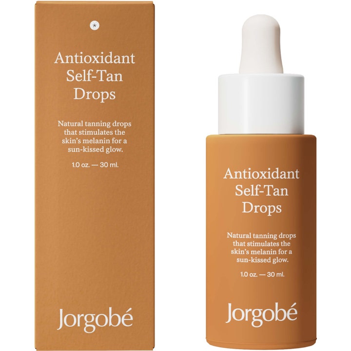 Jorgobé Antioxidant Self-Tan Drops 30 ml tanning drops der giver solkysset glød i brun emballage og pipetteflaske.